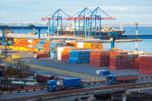 Shipping containers at an international port representing global spirits imports.